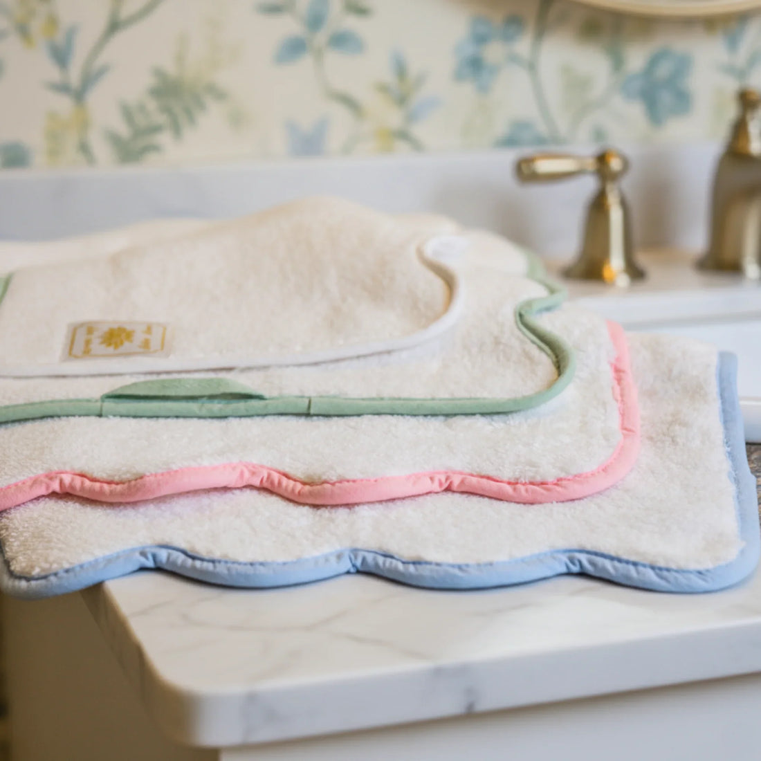 Plush cotton washcloths with pastel scallop piping in green, pink, and blue for indulgent spa-quality comfort - Lotus Linen
