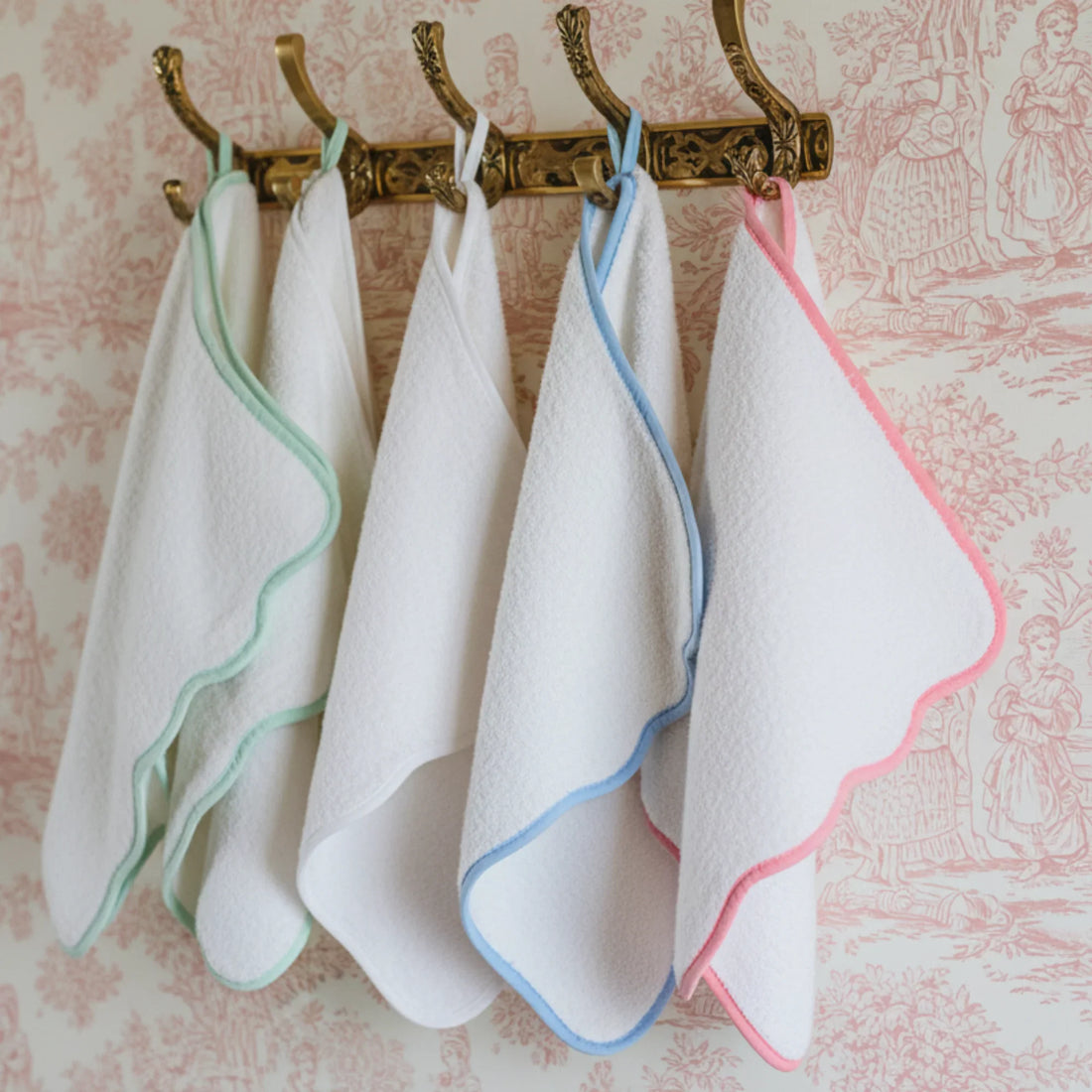 Soft white cotton washcloths with pastel scallop piping in mint, blue, and pink for everyday pampering - Lotus Linen