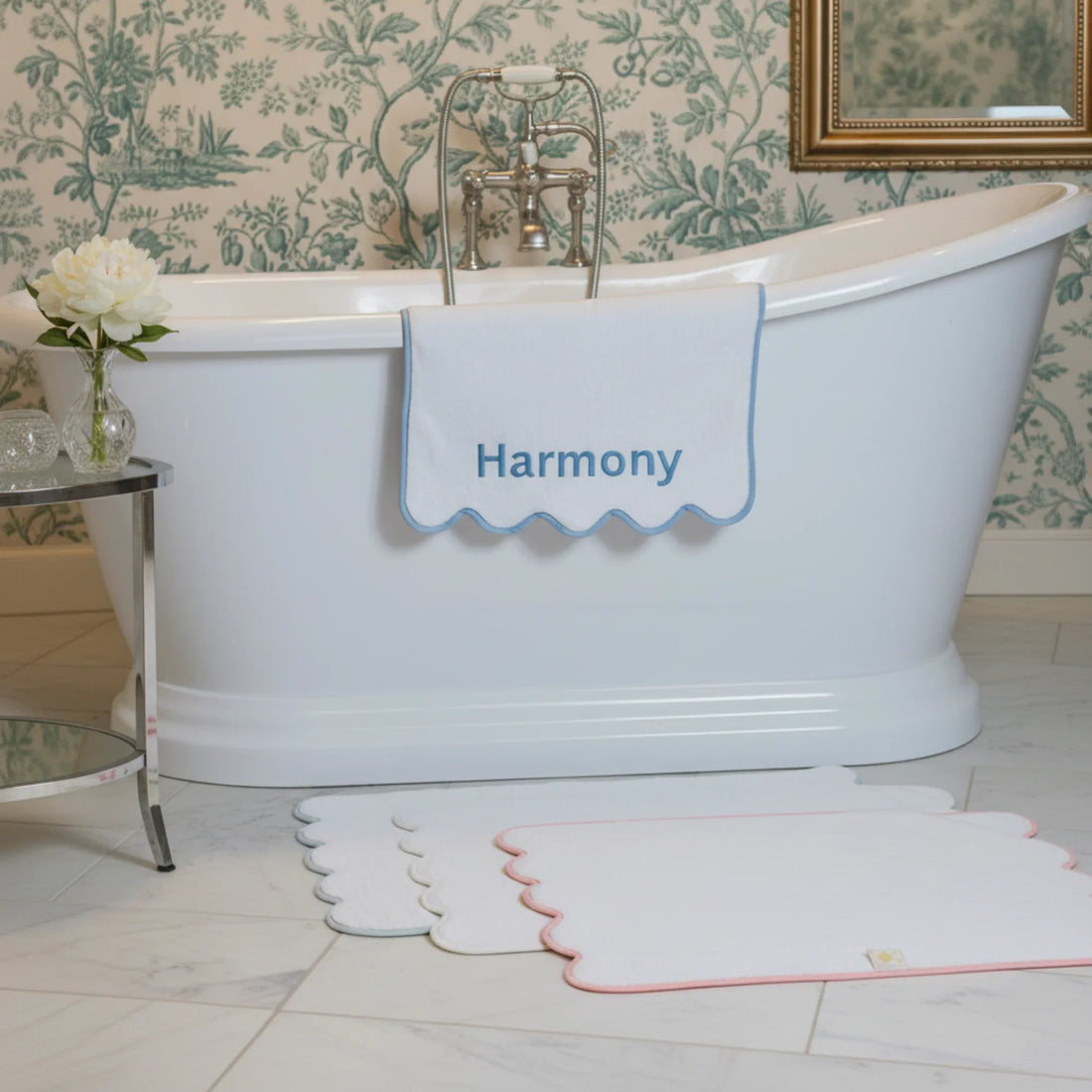 Personalized luxury cotton hand towel with blue scallop piping draped over freestanding tub for spa-worthy softness - Lotus Linen