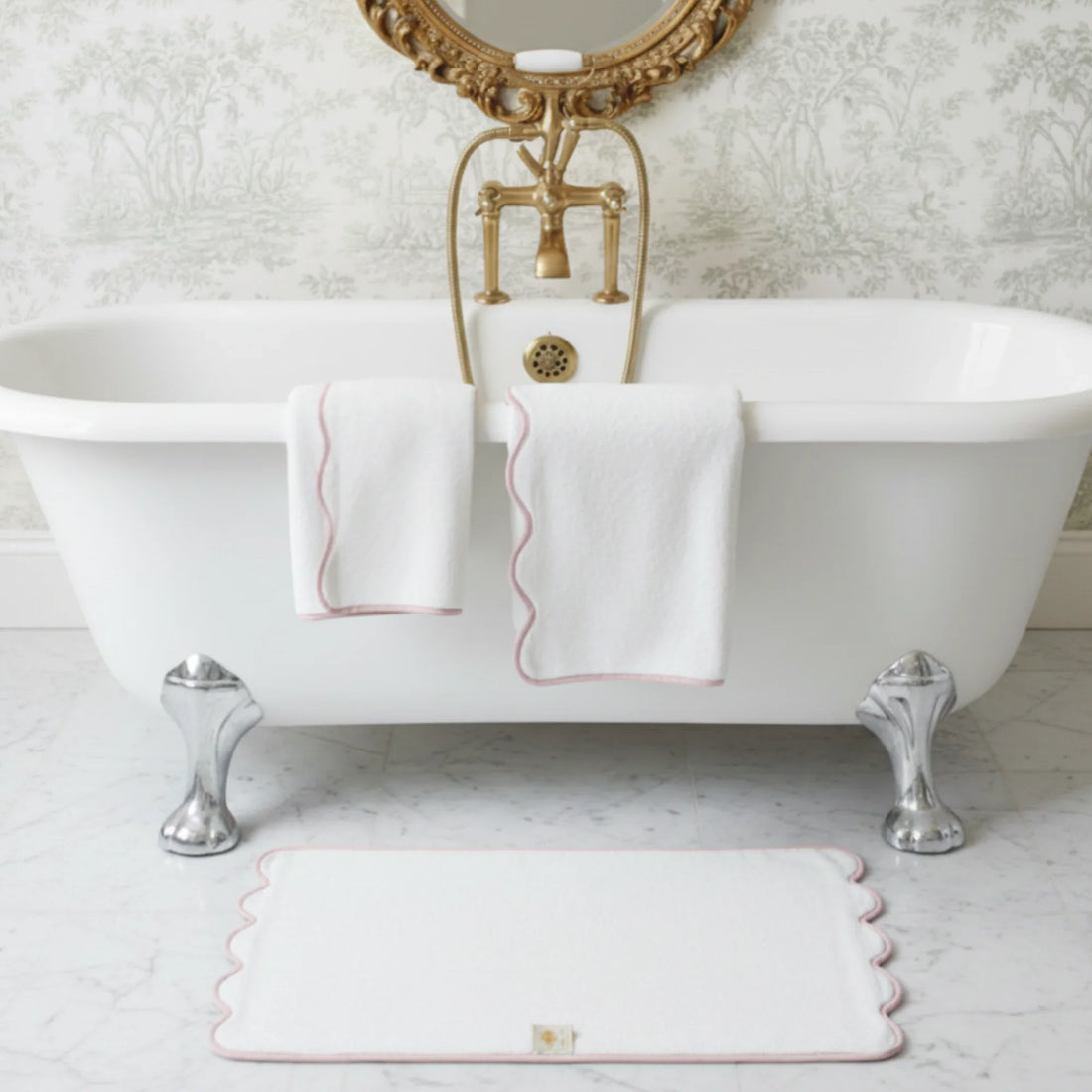 White scallop-piped 6-piece bath towel set with pink trim draped over clawfoot tub for spa-quality comfort - Lotus Linen