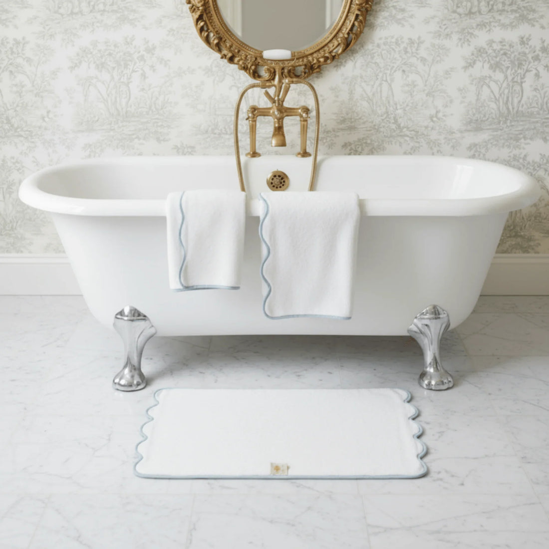 Luxury lovers' fluffy white bath towels with scalloped blue trim for spa-quality comfort at home - Lotus Linen