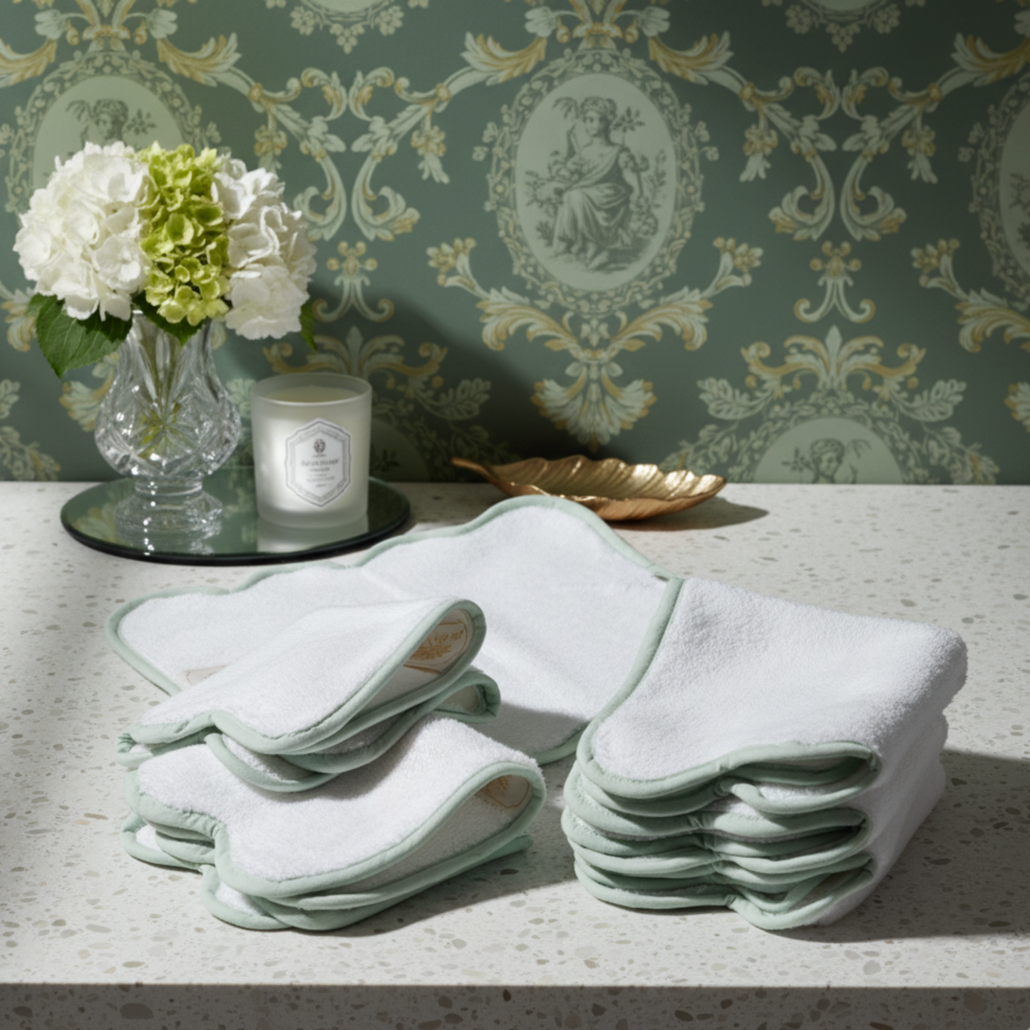 Stacked white scallop-edged cotton hand towels with sage green piping for indulgent spa-quality comfort at home - Lotus Linen