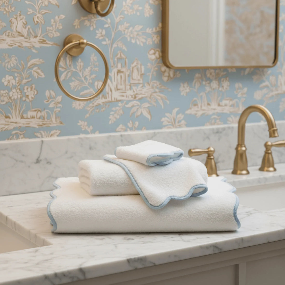 Luxury lovers' fluffy white bath towels with scalloped blue trim for spa-quality comfort at home - Lotus Linen