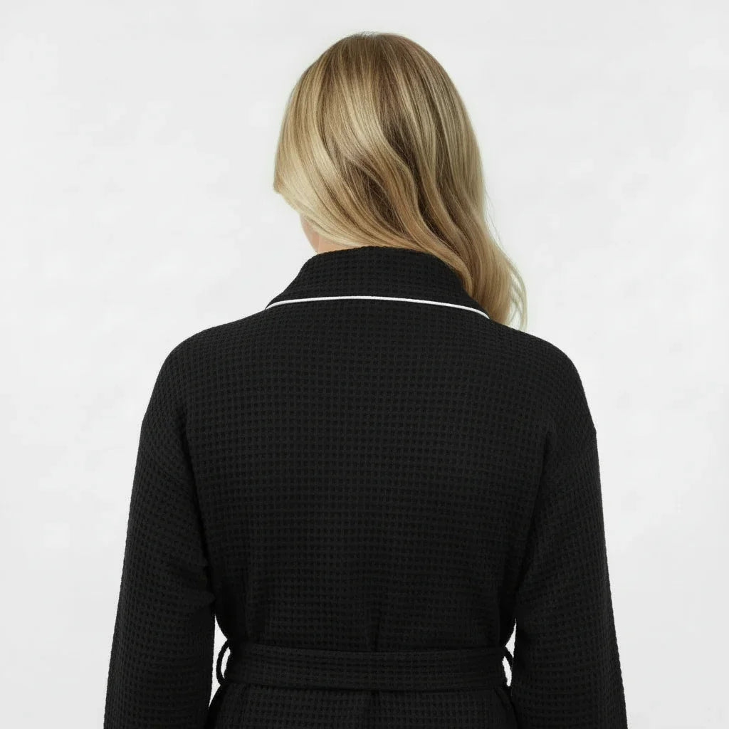 Women's knee-length waffle robe in classic black with white piping for effortless spa-quality comfort - Lotus Linen