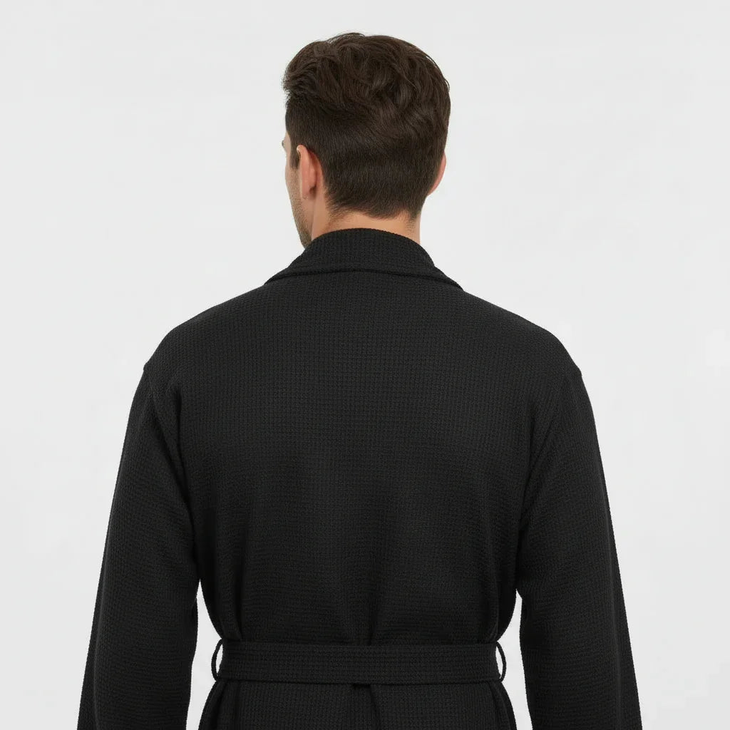Man wearing black waffle spa bathrobe with tie belt for lightweight breathable comfort after every shower - Lotus Linen