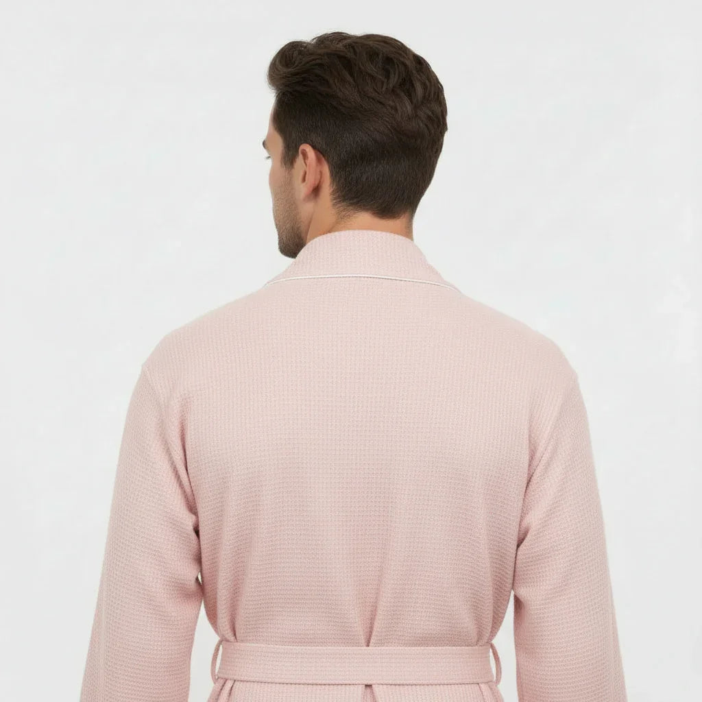 Man wearing soft pink waffle piping robe with elegant trim for effortless spa-quality comfort at home - Lotus Linen