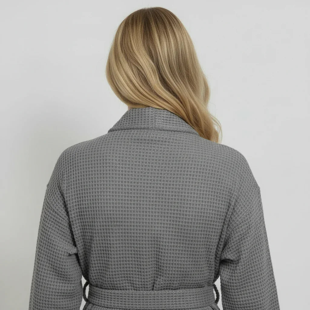 Woman modeling grey waffle-knit knee-length robe with elegant drape for spa-quality comfort at home - Lotus Linen