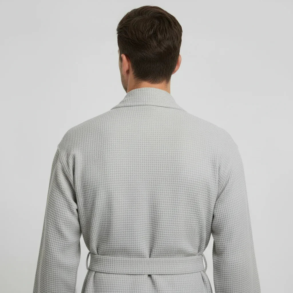 Man wearing light gray waffle spa bathrobe with tie belt, designed for breathable comfort after every shower - Lotus Linen