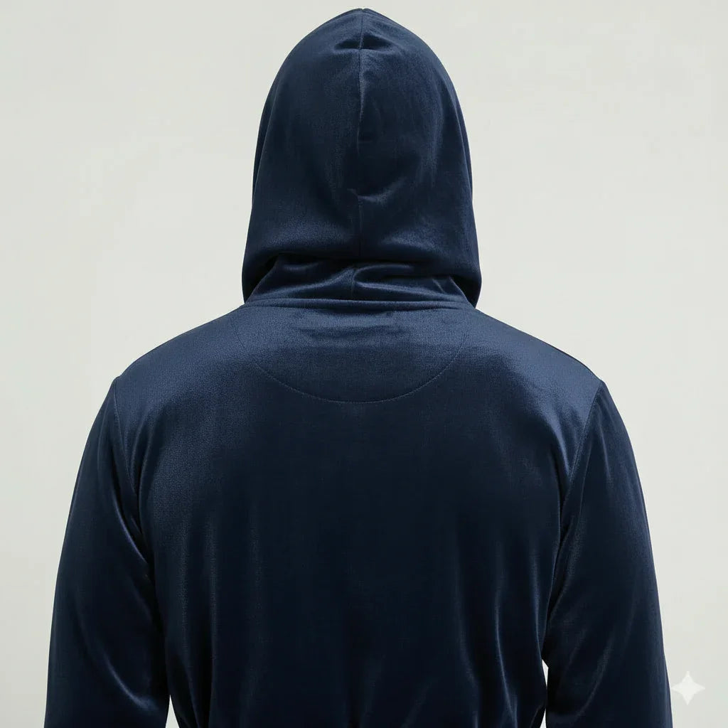 Man wearing navy hooded plush robe shown from behind, wrapped in cozy spa-quality comfort - Lotus Linen