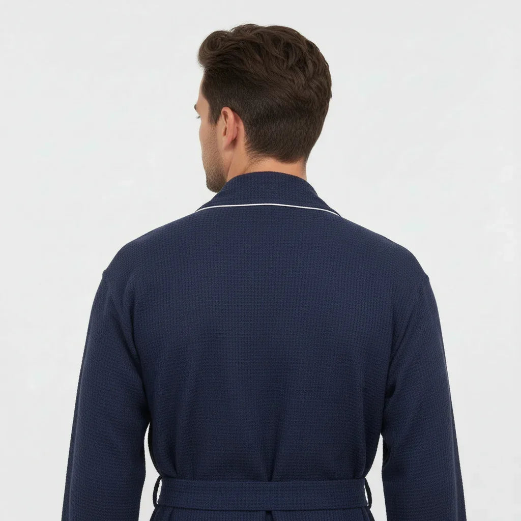 Man wearing navy waffle piping robe with white trim for refined spa-quality comfort at home - Lotus Linen