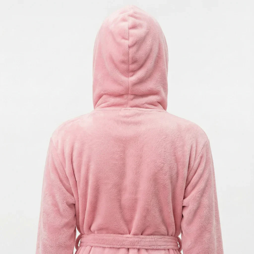 Woman wearing soft pink hooded plush robe shown from back, delivering spa-worthy cozy comfort at home - Lotus Linen