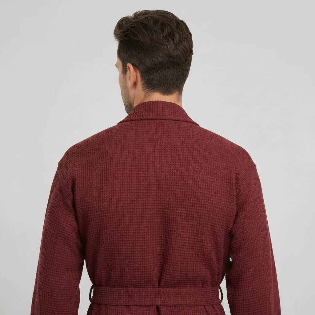 Man in burgundy waffle spa bathrobe enjoying lightweight comfort after a relaxing shower - Lotus Linen
