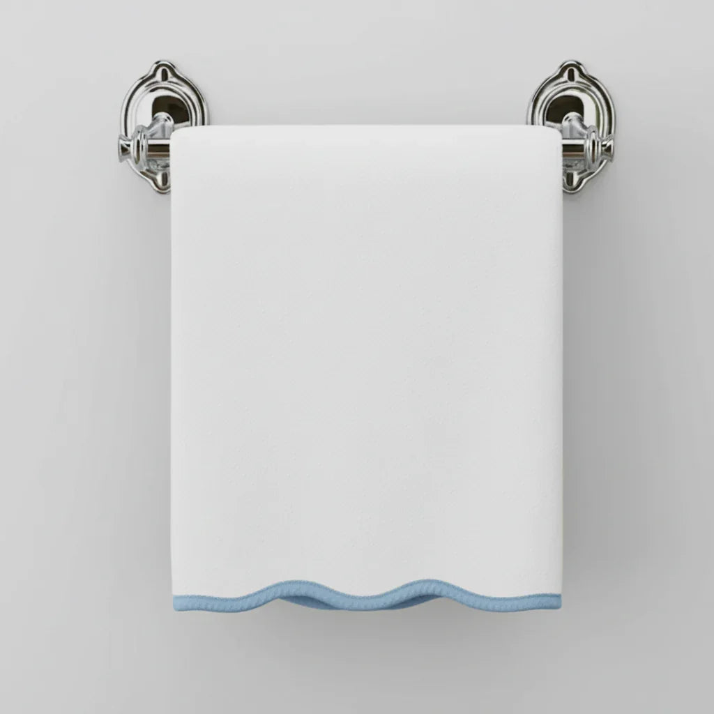 White bath towel with blue scallop trim on chrome holder offering spa-quality softness for your daily ritual - Lotus Linen