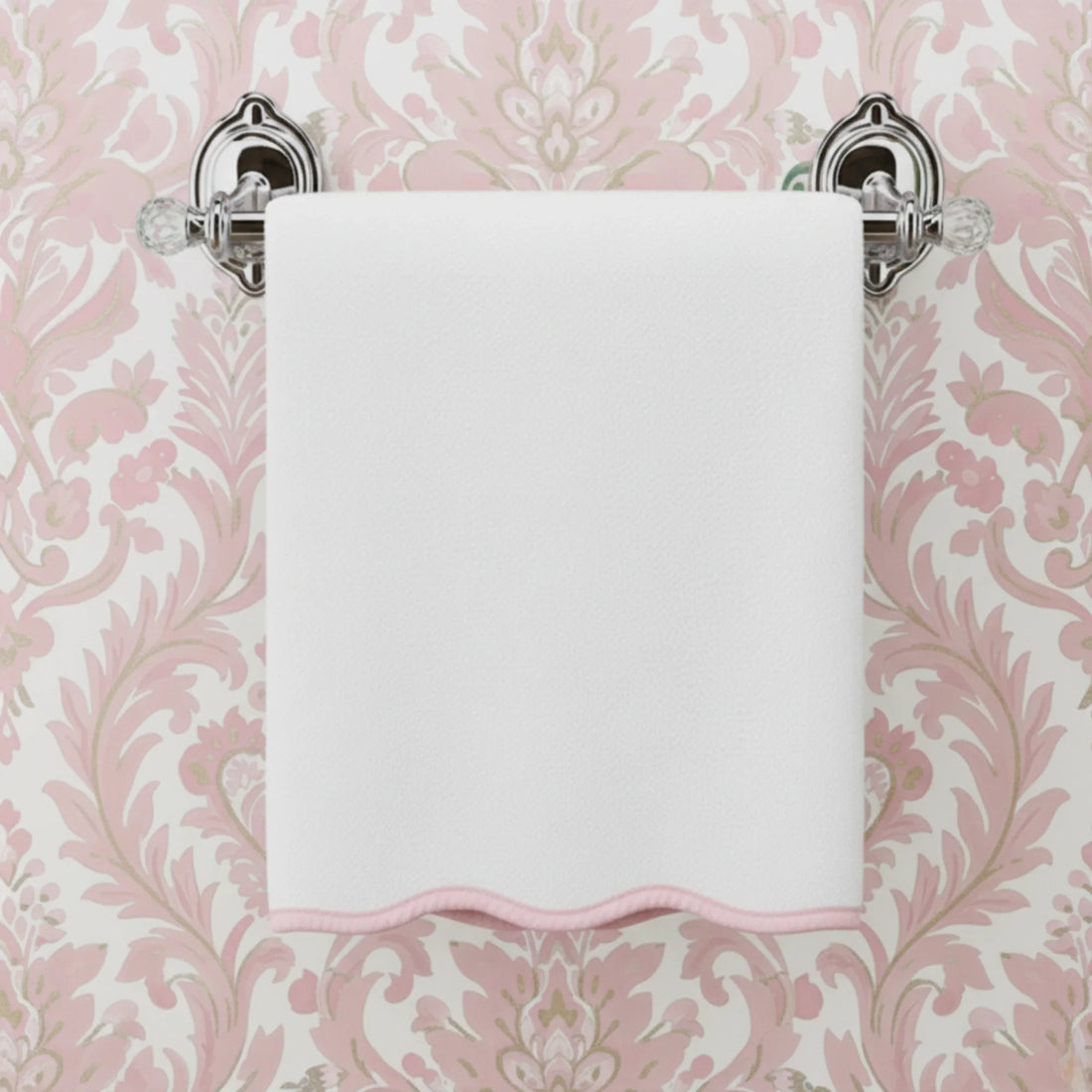 White cotton washcloth with pink scallop piping on elegant towel bar for everyday spa-quality comfort - Lotus Linen