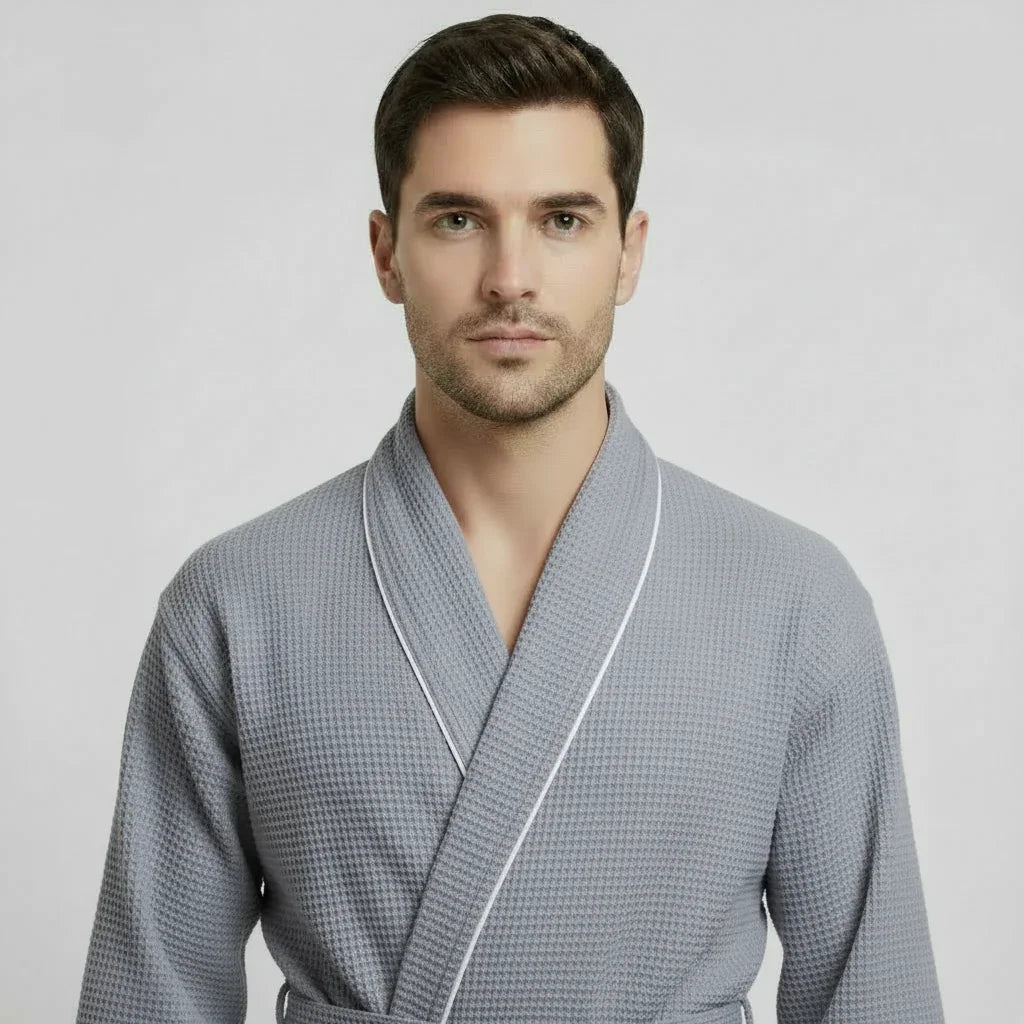 Man wearing grey waffle piping bathrobe with white trim for effortless spa-quality comfort at home - Lotus Linen