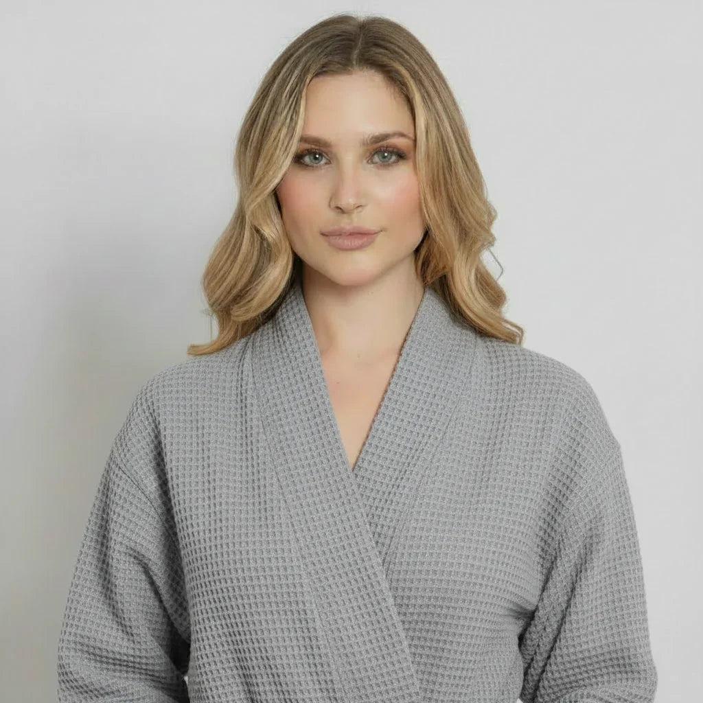 Woman in grey waffle weave robe enjoying lightweight spa-quality comfort after a relaxing bath - Lotus Linen
