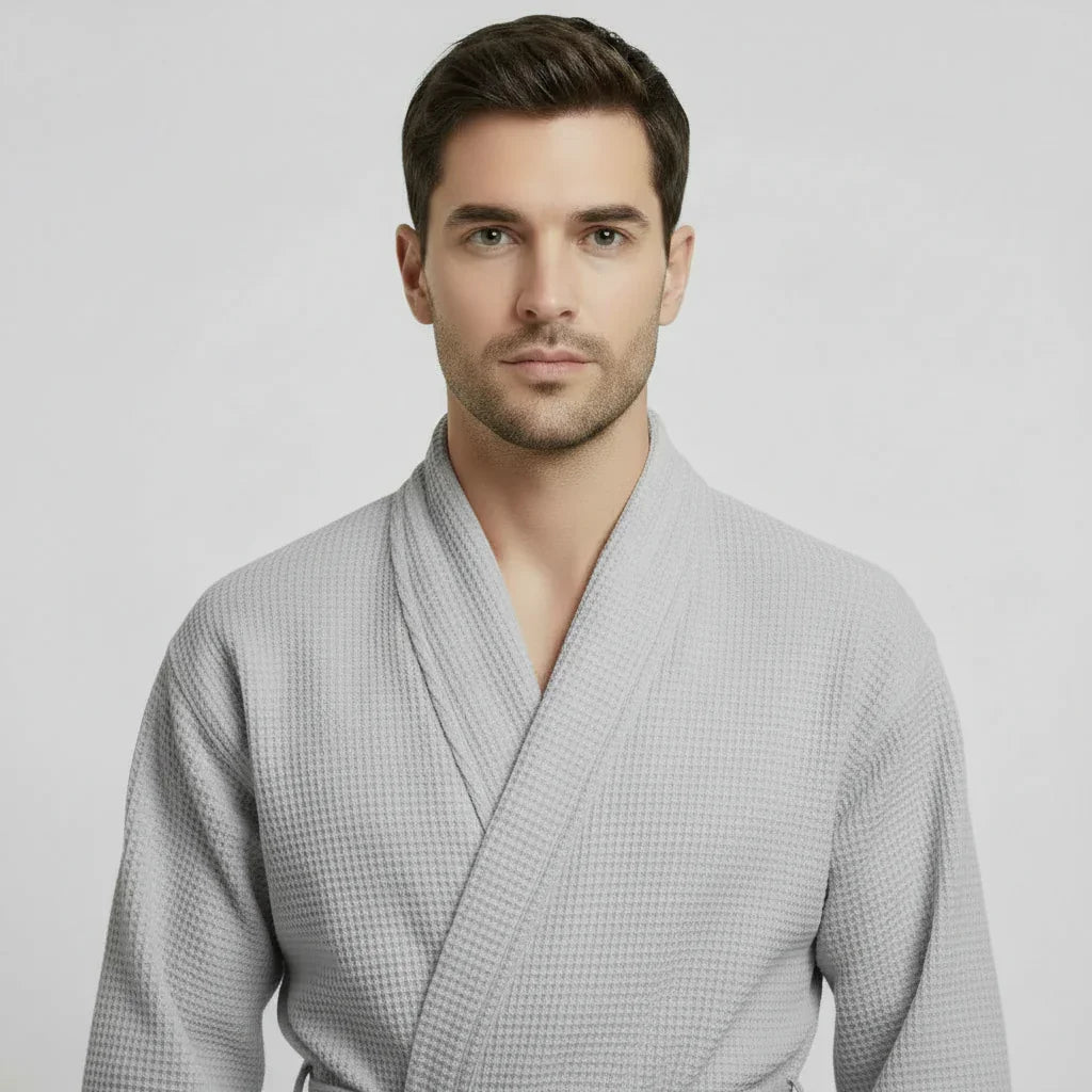 Man wearing light gray waffle spa bathrobe for effortless post-shower comfort and relaxation - Lotus Linen
