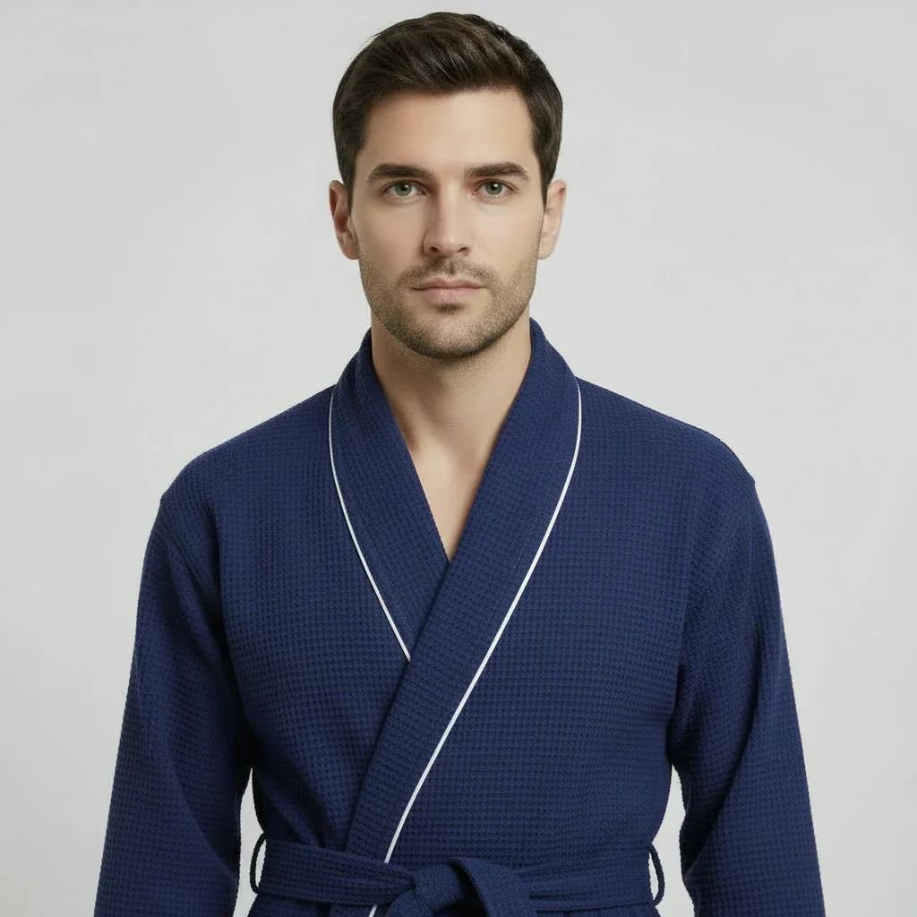 Man in navy waffle piping robe with white trim for effortless spa-quality comfort at home - Lotus Linen
