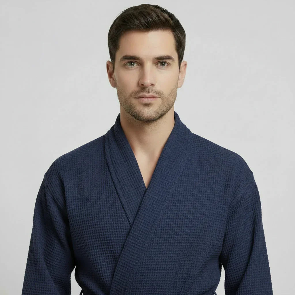 Man wearing navy waffle spa bathrobe with shawl collar for lightweight breathable comfort after every shower - Lotus Linen
