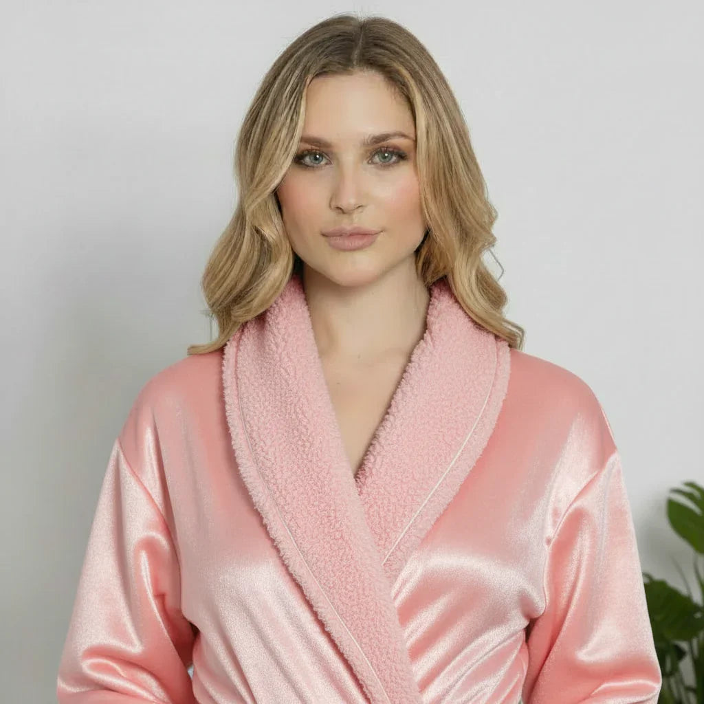 Woman wearing ultra soft pink plush bathrobe with satin finish and cozy shawl collar for spa-quality comfort - Lotus Linen