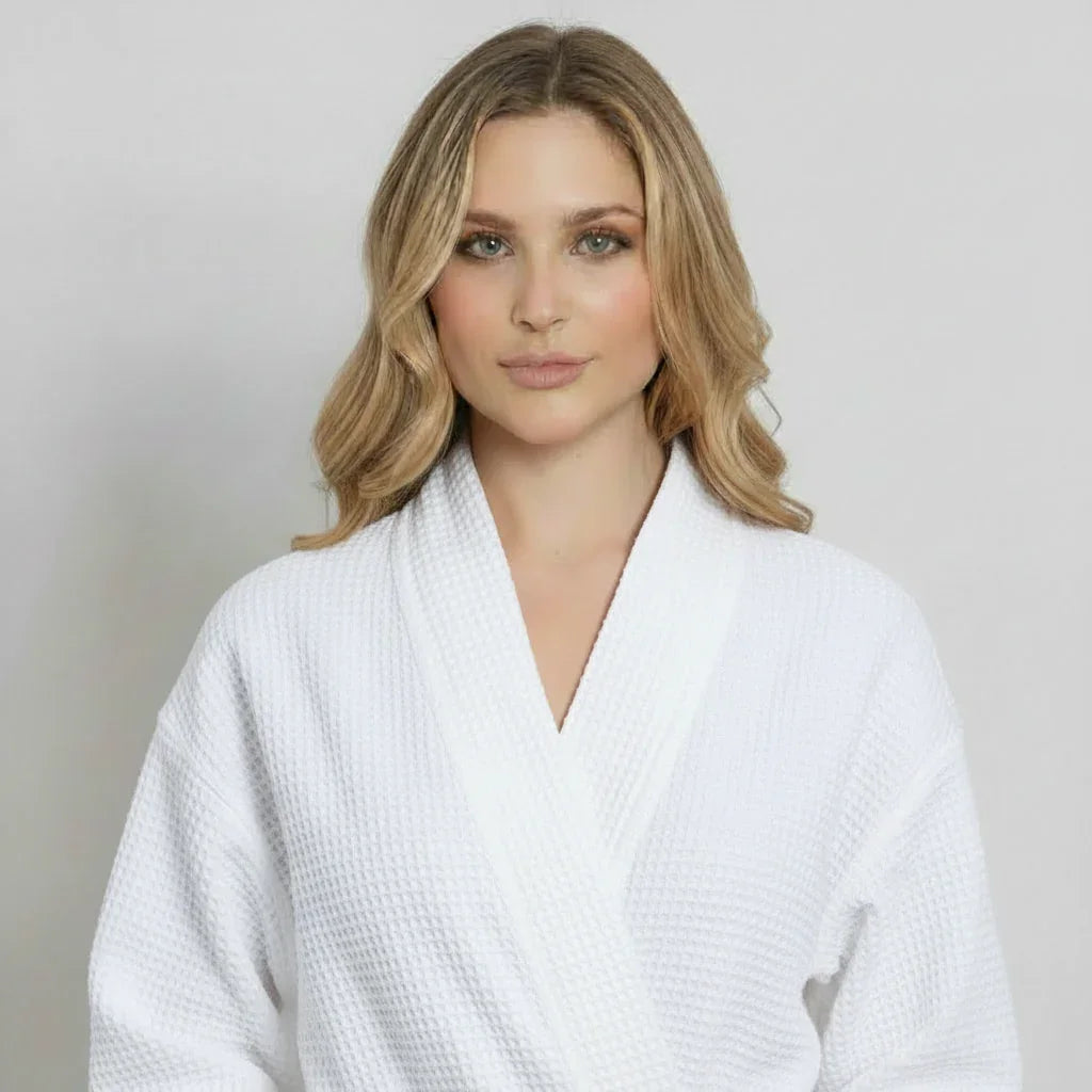 Woman in white waffle bathrobe with shawl collar for effortless spa-quality comfort and relaxation - Lotus Linen