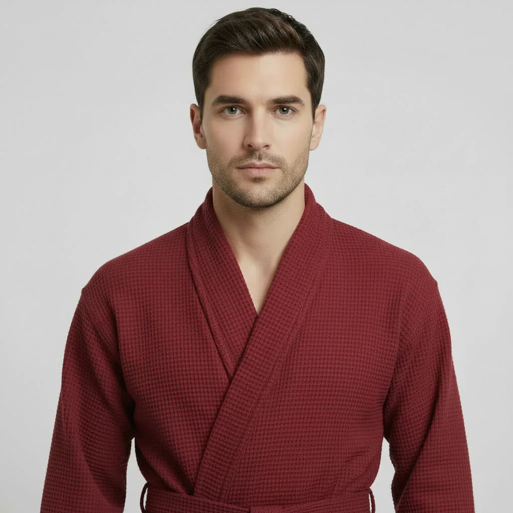 Man wearing burgundy waffle spa bathrobe for lightweight comfort and relaxation - Lotus Linen