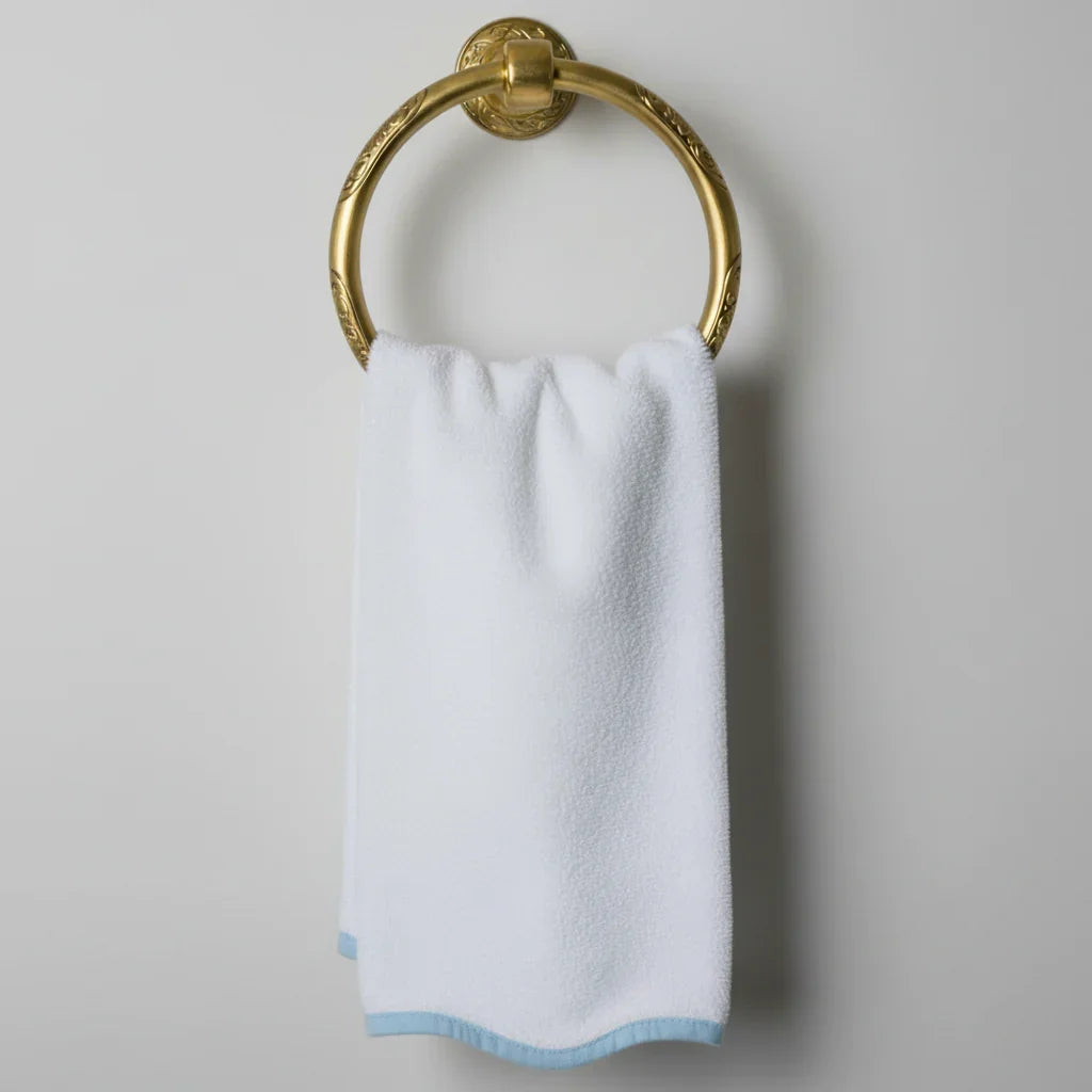 Spa-worthy white cotton hand towel with delicate blue scallop piping on ornate brass ring for everyday indulgence - Lotus Linen