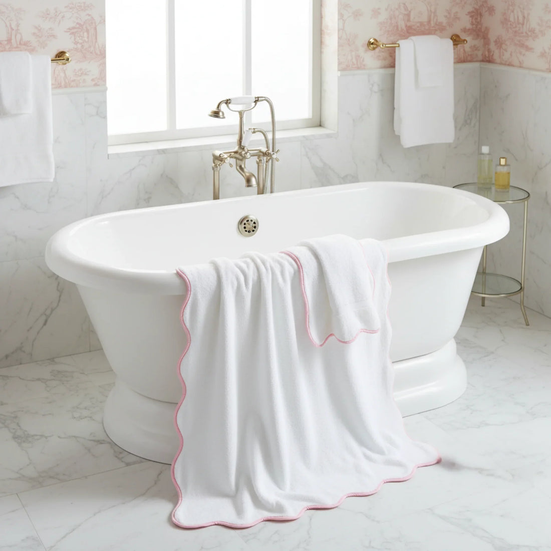 Luxurious oversized scallop piping bath sheet in white with pink trim draped over freestanding tub for spa-worthy softness - Lotus Linen