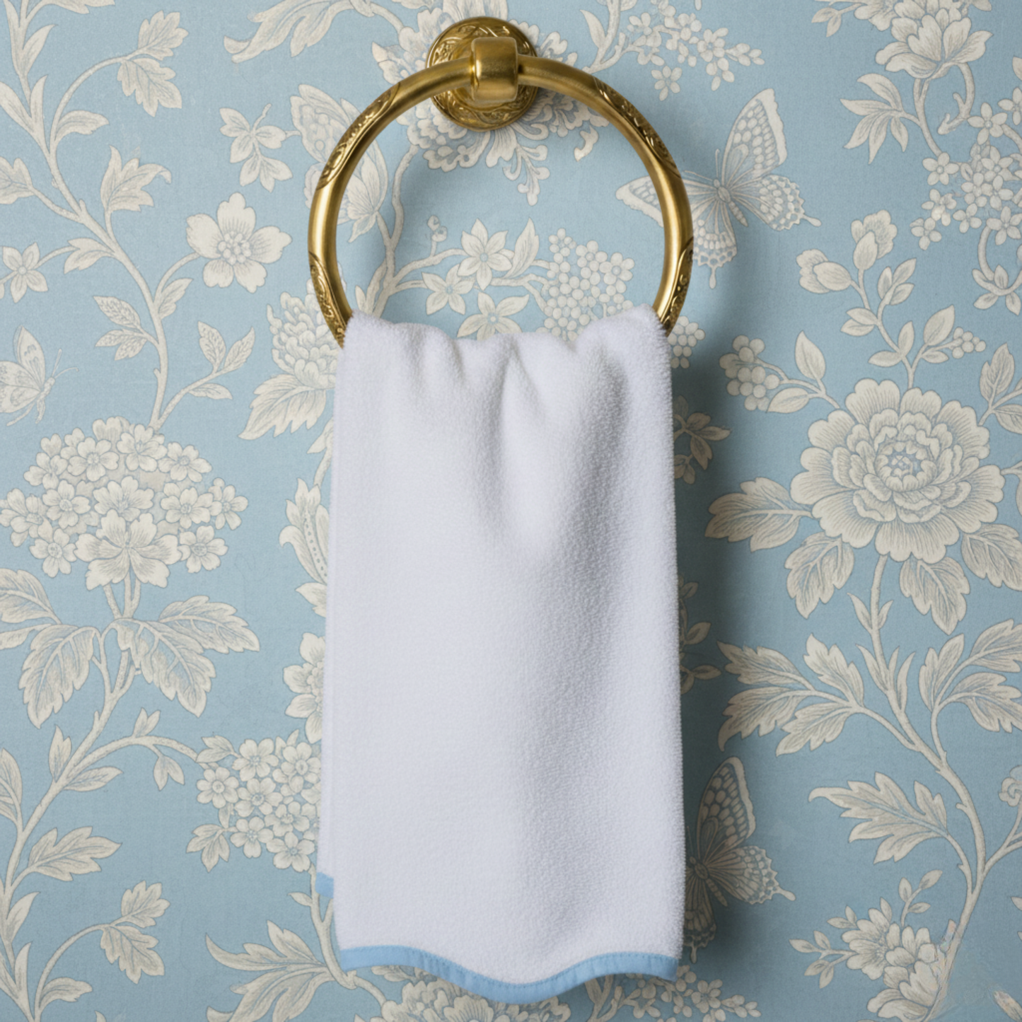 Pamper yourself with a spa-quality white cotton hand towel featuring delicate scallop piping in soft blue - Lotus Linen