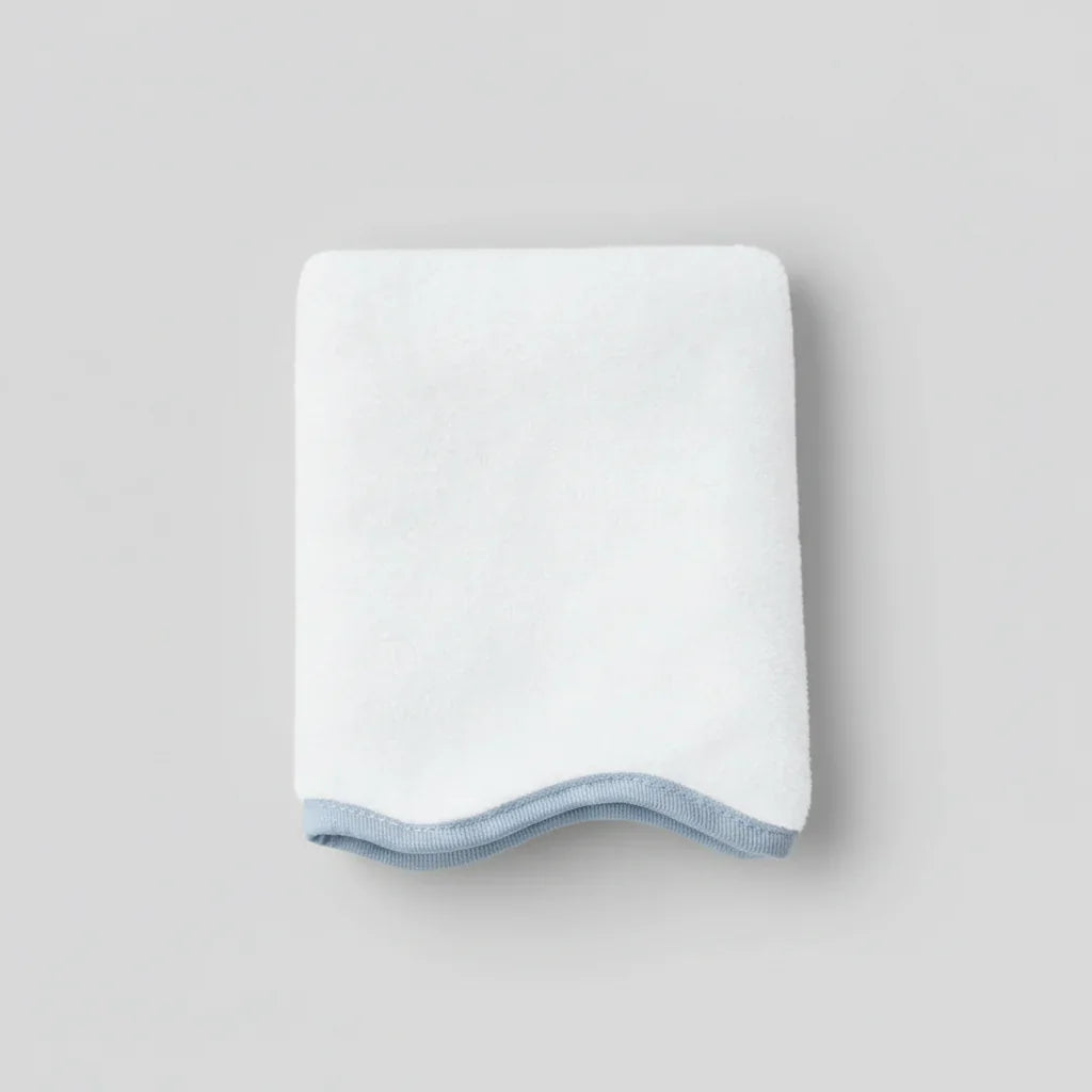 Plush white cotton hand towel with elegant blue scallop piping for spa-quality comfort at home - Lotus Linen