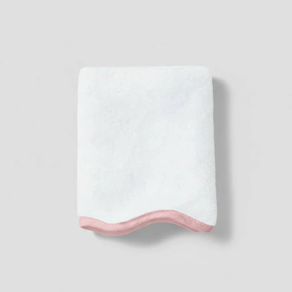 Indulgent white cotton bath mat with soft pink scallop trim for spa-quality comfort underfoot - Lotus Linen