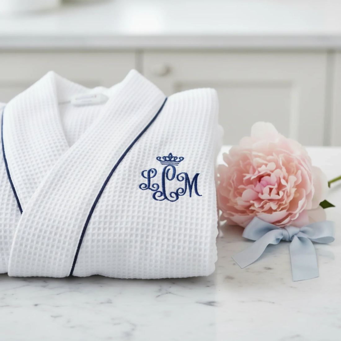 Women's knee-length waffle robe in white with navy monogram piping for spa-quality comfort at home - Lotus Linen